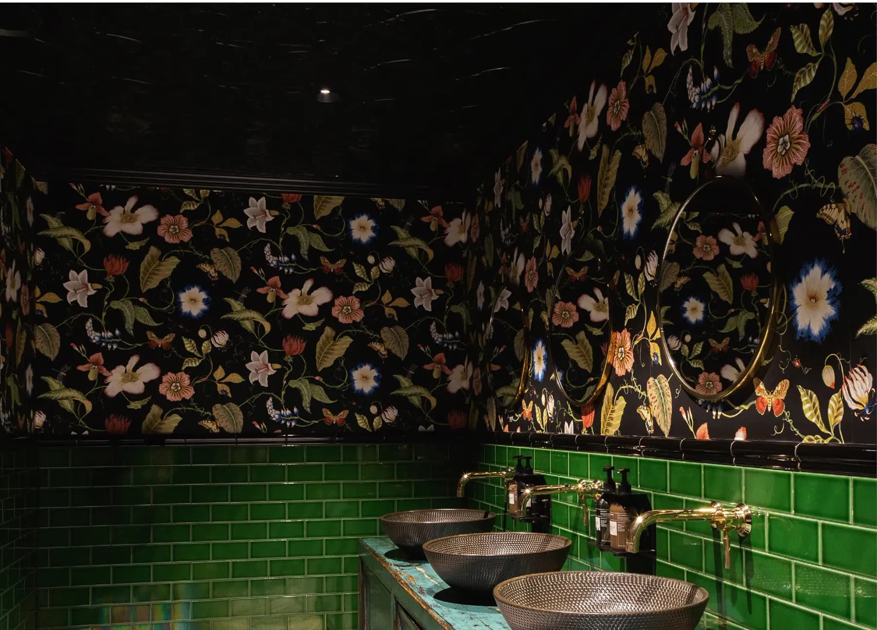 Amazonita restaurant washroom — floral feature wall and green metro tiling, Christchurch