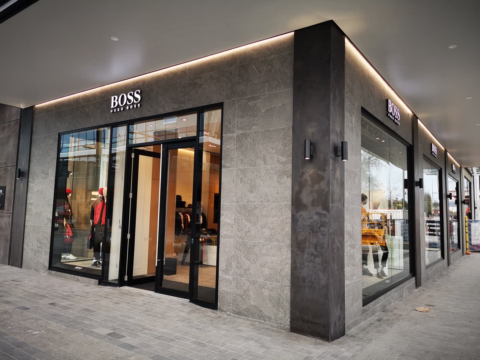Large-format stone cladding and floor tiling for Hugo Boss Christchurch by JSR Tiling